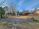 A long driveway with partial view of home and carport on a sunny day at 306 Martin Luther King Jr Dr, Smithfield, NC 27577
