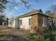 Exterior showing a house with stone and siding, plus a chimney and shed at 306 Martin Luther King Jr Dr, Smithfield, NC 27577
