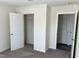 Clean bedroom features neutral walls and access to closet and additional room at 321 Duke Memorial Road, Louisburg, NC 27549