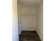 Bright laundry room offers clean, neutral tones, vinyl flooring, and wire shelving at 321 Duke Memorial Road, Louisburg, NC 27549