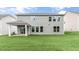 A backyard featuring a patio and a freshly manicured lawn at 329 Umstead St, Sanford, NC 27330