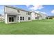 A spacious backyard featuring healthy green grass and a concrete patio at 329 Umstead St, Sanford, NC 27330