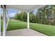 An expansive backyard with lush green grass and a concrete patio off the back of the home at 329 Umstead St, Sanford, NC 27330