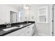 Modern bathroom with double sinks, granite counters, and modern fixtures at 329 Umstead St, Sanford, NC 27330