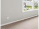Bright bedroom features a neutral color scheme and a view of the neighborhood at 329 Umstead St, Sanford, NC 27330