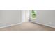 Neutral carpet in a home bedroom featuring white walls and door trim at 329 Umstead St, Sanford, NC 27330