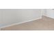 Neutral carpet in a home bedroom featuring white walls and door trim at 329 Umstead St, Sanford, NC 27330