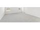 Spacious bedroom featuring neutral carpeting, two windows and painted in light grey at 3405 Rosebush Dr, Zebulon, NC 27597