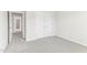 Bedroom with plush carpet and double doors that lead to a closet or storage area at 3405 Rosebush Dr, Zebulon, NC 27597