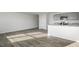 Open living room features plank floors and neutral paint, providing a bright atmosphere at 36 Sweet Meadow Rd, Angier, NC 27501