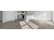 Bright open-concept kitchen flows into the spacious living area with durable floors at 36 Sweet Meadow Rd, Angier, NC 27501