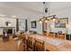 Bright dining room with vaulted ceilings, wood floors and modern lighting at 3816 Saratoga Dr, Raleigh, NC 27604