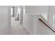 Bright upstairs hallway featuring carpeted floors and white walls at 4108 Overcup Oak Ln, Cary, NC 27519