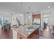 Kitchen with stainless appliances, sink island, granite countertops and seating at 4108 Overcup Oak Ln, Cary, NC 27519