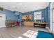 Snack area in recreation room featuring sink, cabinets, and drink fridge at 4108 Overcup Oak Ln, Cary, NC 27519