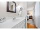 Bathroom vanity with white countertop and natural light, offering a glimpse into the bedroom at 4209 Converse Dr, Raleigh, NC 27609
