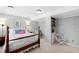 Comfortable bedroom with neutral color scheme, a wood bed frame and built-in shelving at 4209 Converse Dr, Raleigh, NC 27609