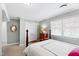 This bedroom features a bed frame, closet, and gray walls with white trim at 4209 Converse Dr, Raleigh, NC 27609