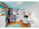 Spacious walk-in closet providing generous storage solutions with built-in shelves and rods at 4209 Converse Dr, Raleigh, NC 27609