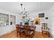 Inviting dining room featuring a chandelier, hardwood floors, and a beautiful wood table at 4209 Converse Dr, Raleigh, NC 27609