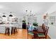 Dining room combined with kitchen, featuring hardwood floors, white ceiling and many windows at 4209 Converse Dr, Raleigh, NC 27609
