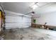 Empty garage with a white door and some tools and household items at 4209 Converse Dr, Raleigh, NC 27609