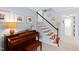 Hallway with a piano and staircase, offering an inviting and musical atmosphere at 4209 Converse Dr, Raleigh, NC 27609