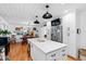 Bright kitchen with island, stainless steel appliances, and an adjacent dining area at 4209 Converse Dr, Raleigh, NC 27609