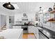 Bright kitchen features white cabinetry, subway tile backsplash, stainless steel appliances, and stylish lighting at 4209 Converse Dr, Raleigh, NC 27609
