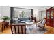 Bright and airy living room with hardwood floors, large windows and stylish furniture at 4209 Converse Dr, Raleigh, NC 27609