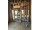 Interior framing showcases new construction, wiring, and doorway in a home at 425 S Mercer St, Rocky Mount, NC 27801