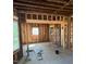 Open concept interior framing shows room's potential with multiple windows and wiring at 425 S Mercer St, Rocky Mount, NC 27801