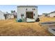 Large backyard featuring a hammock, patio set, and a grill, perfect for outdoor entertaining at 440 Pierce Landing Dr, Garner, NC 27529