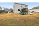 Expansive backyard featuring a patio set and a grill, perfect for outdoor entertaining at 440 Pierce Landing Dr, Garner, NC 27529