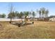 Large backyard with a playground area featuring a swing set, slide, and mulch, perfect for Gathering fun at 440 Pierce Landing Dr, Garner, NC 27529