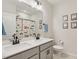 Bright bathroom with double sinks, modern fixtures, and fun construction-themed decor at 440 Pierce Landing Dr, Garner, NC 27529