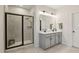 Bathroom with tiled walk-in shower, granite countertop vanity, and framed mirror at 440 Pierce Landing Dr, Garner, NC 27529
