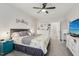 Spacious bedroom with neutral decor, ceiling fan, and access to a bathroom at 440 Pierce Landing Dr, Garner, NC 27529