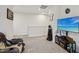 Bonus room with a coastal TV display, gaming accessories, and sports memorabilia wall art at 440 Pierce Landing Dr, Garner, NC 27529