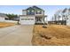 Charming two-story home with a welcoming front porch and a well-manicured lawn at 440 Pierce Landing Dr, Garner, NC 27529