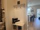 Hallway with a coat rack and storage which leads to an open kitchen space at 440 Pierce Landing Dr, Garner, NC 27529