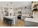 Spacious kitchen featuring gray cabinetry, stainless steel appliances, and a large island with seating at 440 Pierce Landing Dr, Garner, NC 27529