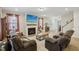 Cozy living room features a fireplace and large windows, creating a relaxing atmosphere at 440 Pierce Landing Dr, Garner, NC 27529