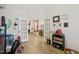 Play room with french doors leading to the living room and decorative wall hangings and crown molding at 440 Pierce Landing Dr, Garner, NC 27529