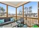 Inviting screened porch with comfortable seating, string lights, and a view of the backyard at 440 Pierce Landing Dr, Garner, NC 27529