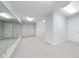 Spacious basement featuring carpet and a large mirror at 4405 Turnberry Cir, Durham, NC 27712