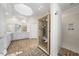 Bright bathroom featuring a sauna, double vanity, and modern shower with custom tile and fixtures at 4405 Turnberry Cir, Durham, NC 27712