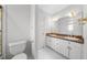 Bathroom with dual sink vanity and modern fixtures at 4405 Turnberry Cir, Durham, NC 27712