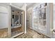 Bathroom featuring a glass sauna, tiled floors, and natural light at 4405 Turnberry Cir, Durham, NC 27712