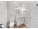 Clean bathroom features white vanity, toilet, and neutral paint at 4405 Turnberry Cir, Durham, NC 27712